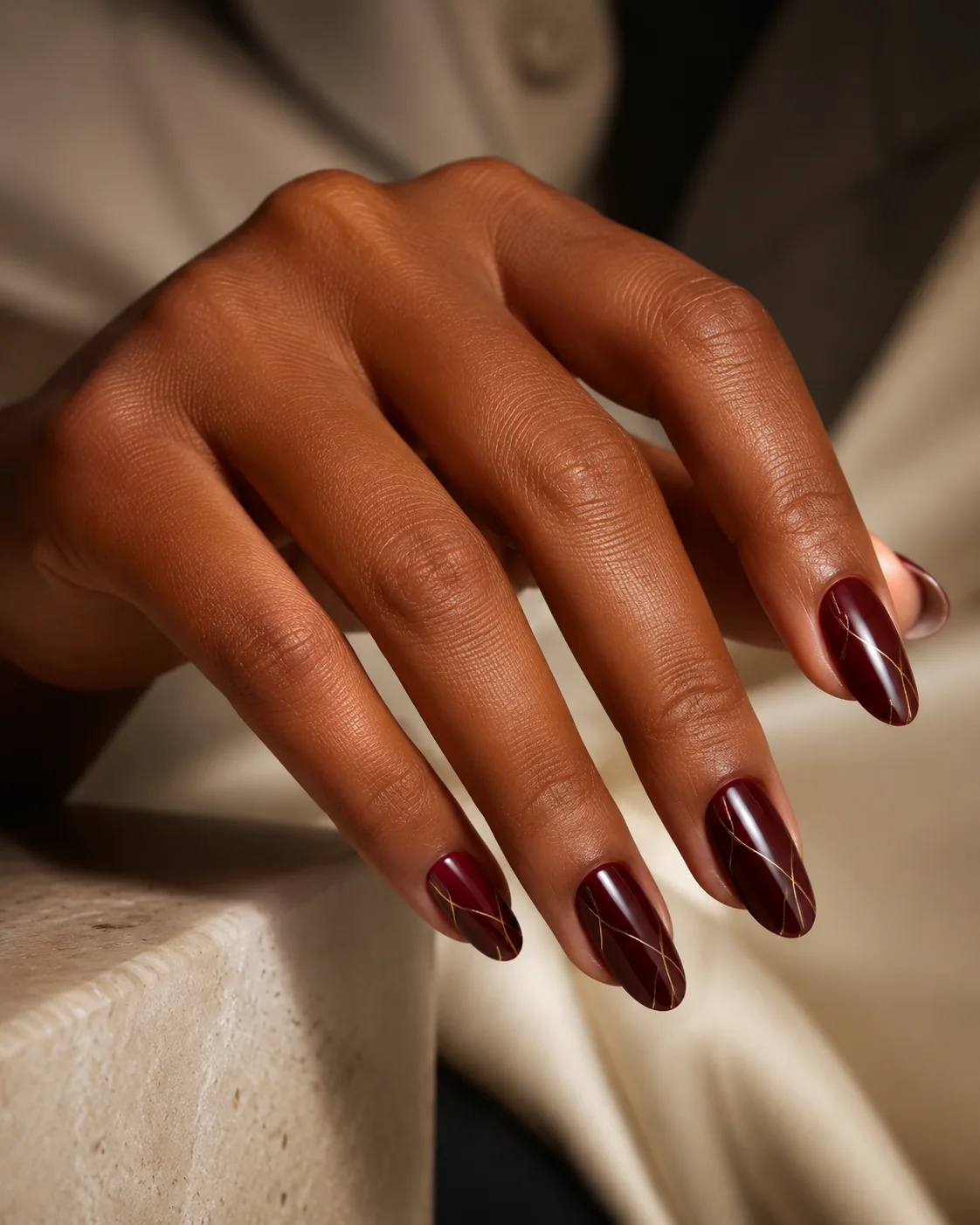 Diseño burgundy con líneas doradas creado por Francia